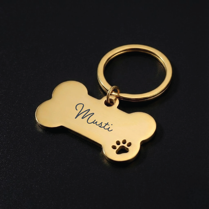 Koiranluu tassulla-avaimenperä omalla tekstillä